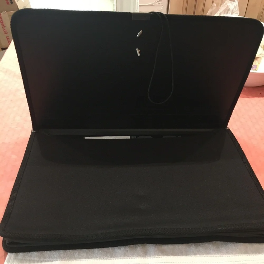 Portfolio legal size in black material. NWOT